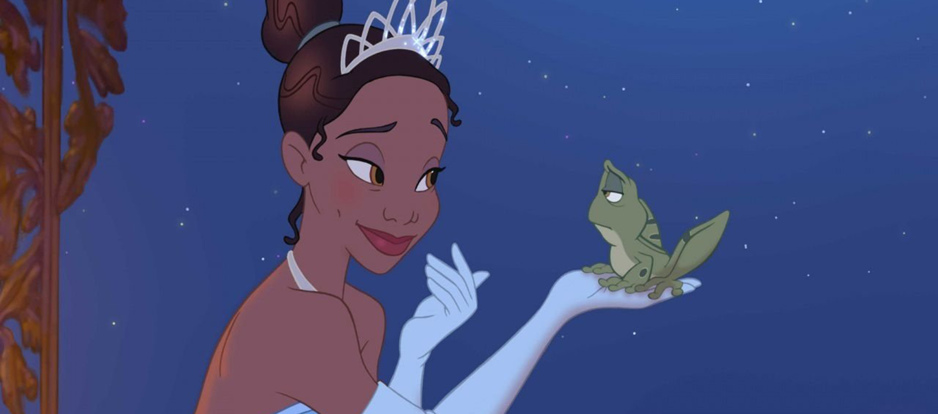An animated image of Tiana holding a frog and smiling at it. Tiana wears a tiara and gloves. The frog looks unamused.