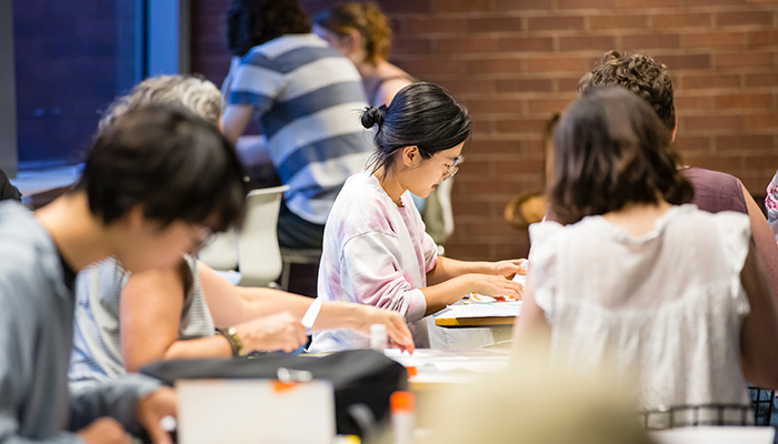 A group of people sit in Heirloom Café.
