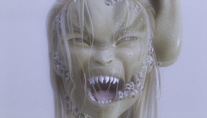 A human-like creature bares pointy teeth. It has greenish-gray skin, thin white hair, and barnacle-like growths on its face.