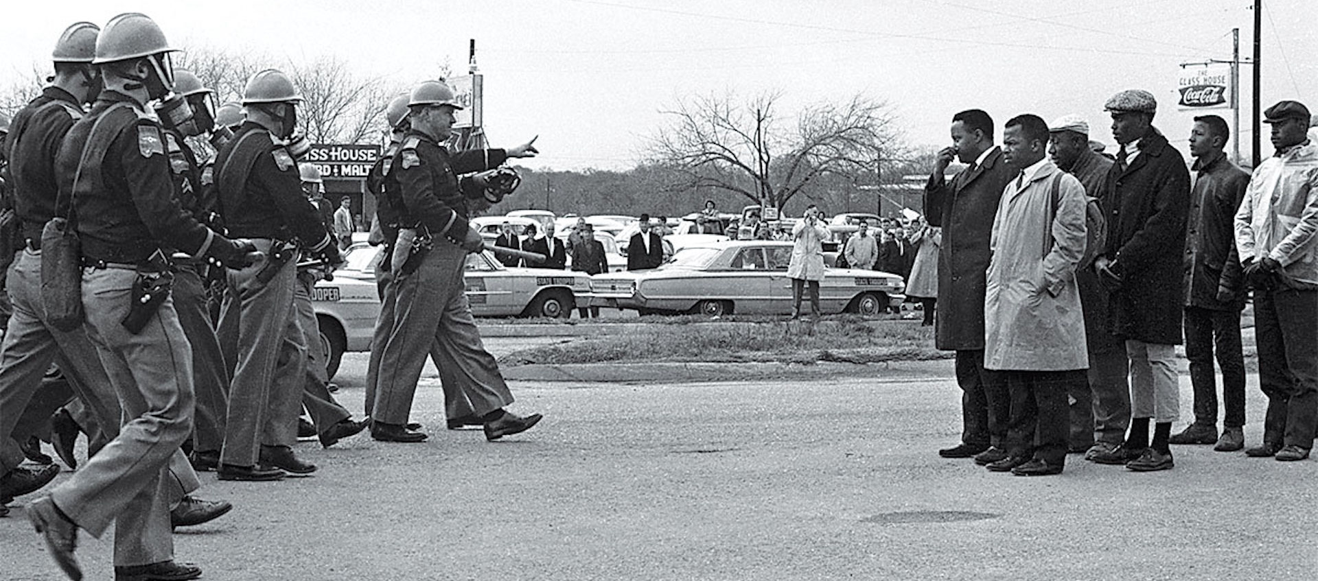 African American protesters face off against police during the Civil Rights Movement in an archive image from the documentary I Am Not Your Negro